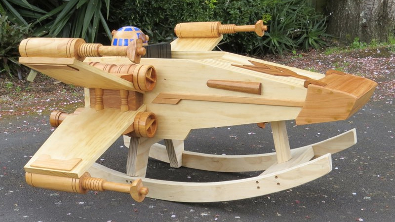 Illustration for article titled This Exquisite Wooden X-wing Rocker Will Make You Miss Being a Kid
